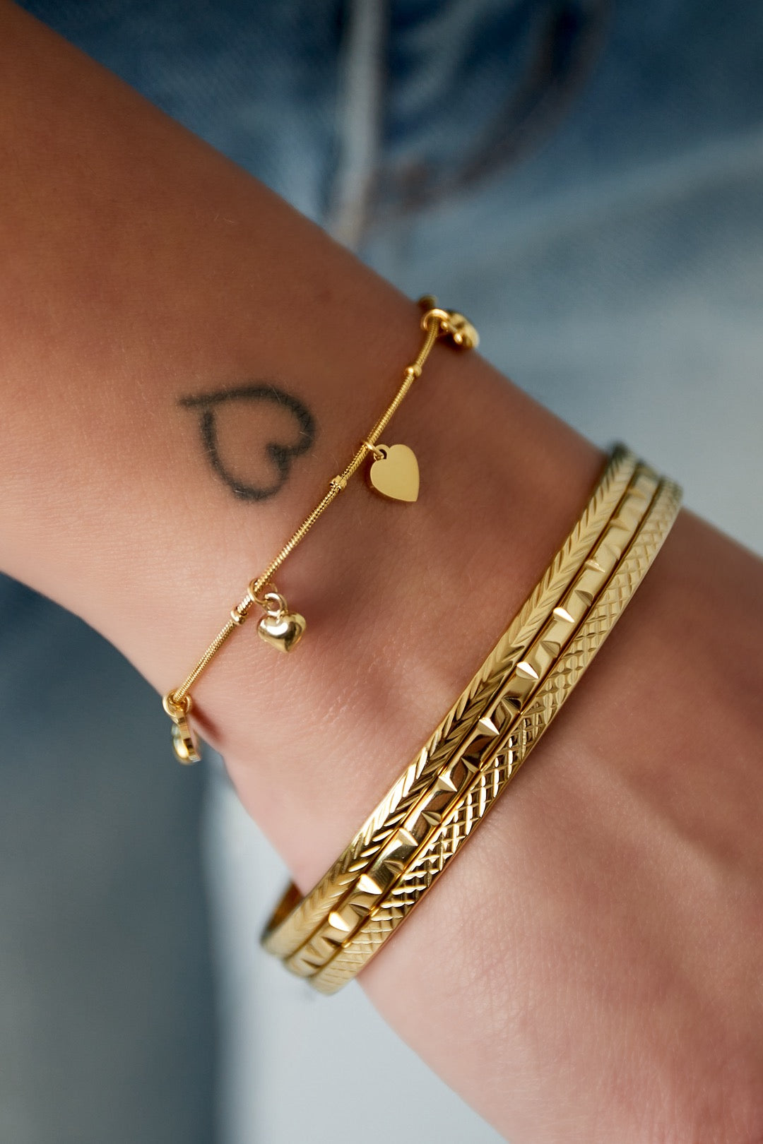 Mini hartjes armband - goud