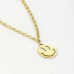 Happy face ketting - goud